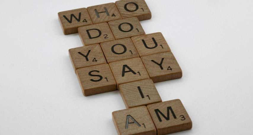 Scrabble Tiles on White Surface
