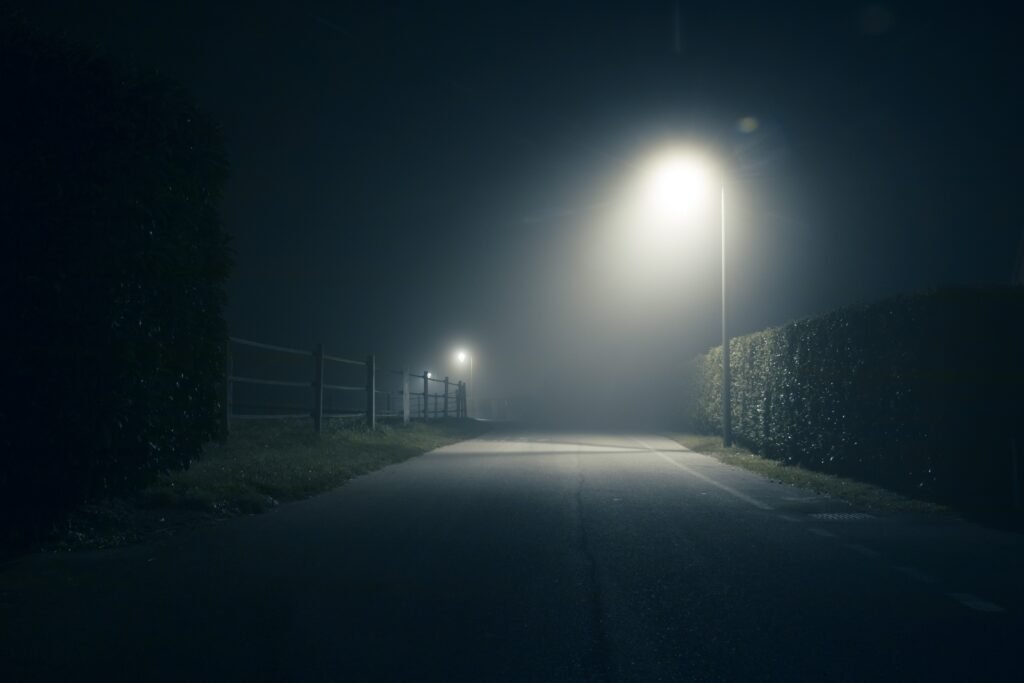 A mysterious street during the night, full of mist. Photo credit adrien-brunat.com