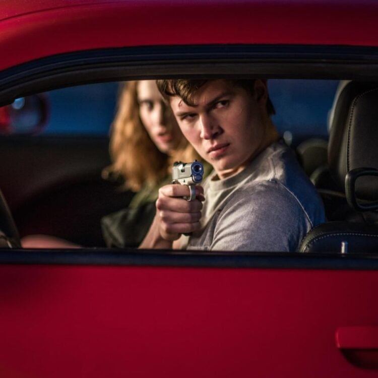 Lily James and Ansel Elgort in Baby Driver (2017) Photo by Wilson Webb - © 2017 TriStar Pictures, Inc